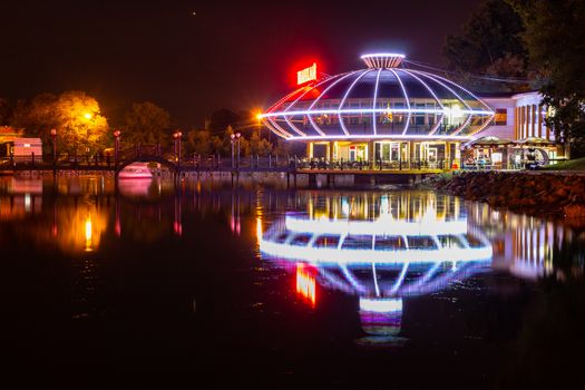 Night city landscape. City ponds Khabarovsk in the light of lanterns, which are reflected in the water.