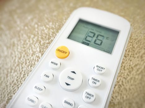 Display of an air conditioner remote control with temperature set at 26 degrees