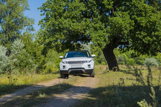 Car Land Rover Range Rover in summer Sunny weather in the summer landscape of the Samara region, Russia. August 21, 2018.