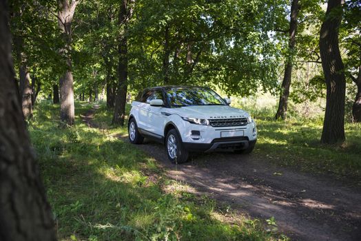 Car Land Rover Range Rover in summer Sunny weather in the summer landscape of the Samara region, Russia. August 21, 2018.