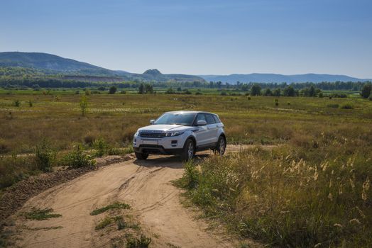 Car Land Rover Range Rover is in the field on a Sunny autumn day near the city of Samara, Russia. August 1, 2018.