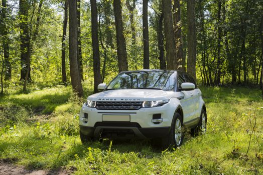 Car Land Rover Range Rover in summer Sunny weather in the summer landscape of the Samara region, Russia. August 21, 2018.