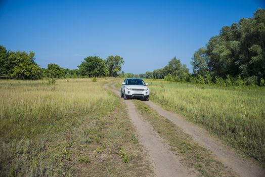 Car Land Rover Range Rover in summer Sunny weather in the summer landscape of the Samara region, Russia. August 21, 2018.