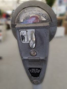 Retro parking meter with time isolated on white background.