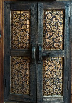 A old wood windows. Beautiful art paint on wood Thai stye craftsmanship