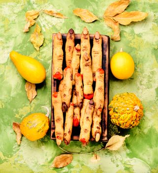 Halloween finger cookies on wooden table. Halloween party.