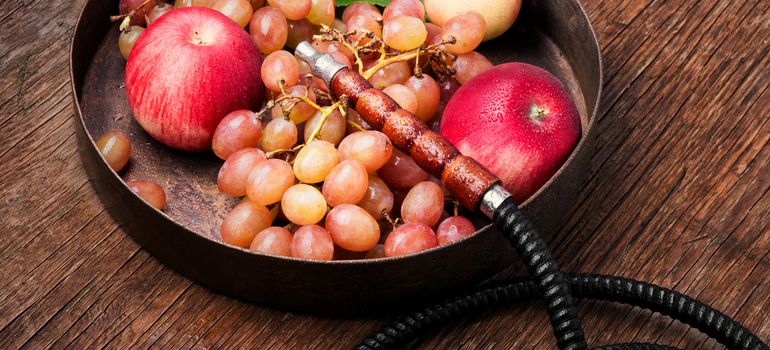 Turkish smoking hookah with taste of a fruit mixture of grapes and apples.Shisha concept. Fruit taste of hookah.