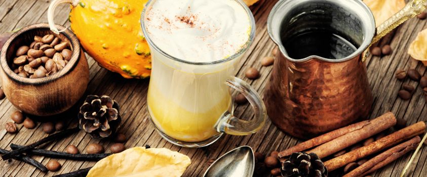 Pumpkin spice latte.Cup with autumn coffee.Coffee drink.Autumn hot drink