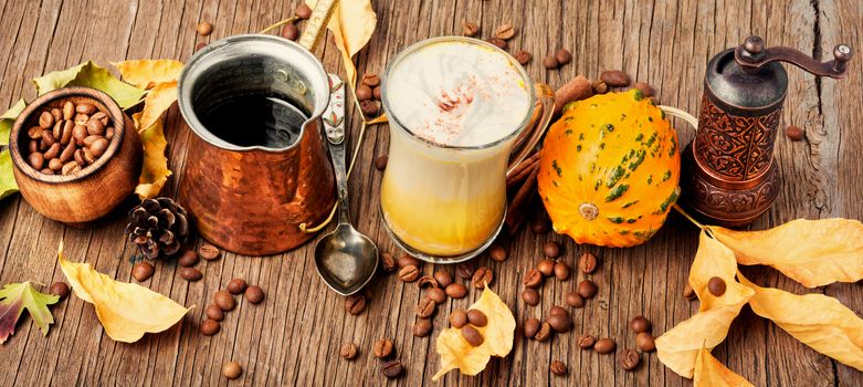 Pumpkin spice latte.Cup with autumn coffee.Coffee drink