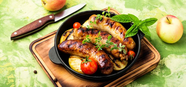 Delicious sausages grilled with spices and apples.Meat German food