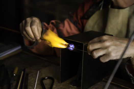 Blowing glass in a traditional way, art detail