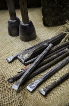 Old tools for carving stone of handmade way, detail of old manual craft
