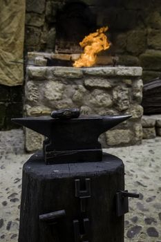 Carbon fire in a forge, detail of a workshop with iron