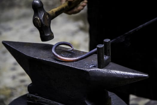 Iron incandescent in an old metal forge, industry detail