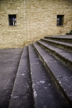 Staircase with window detail of old stone stairs, textured background, ancient architecture