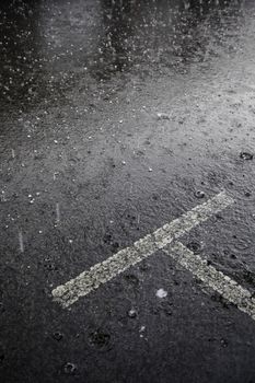 Rain on the asphalt, detail of cold and rain