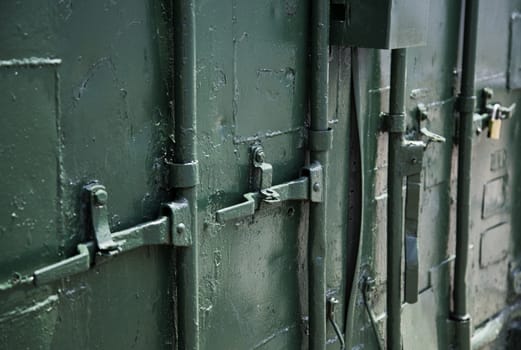 Iron door in a warehouse, detail of security and protection
