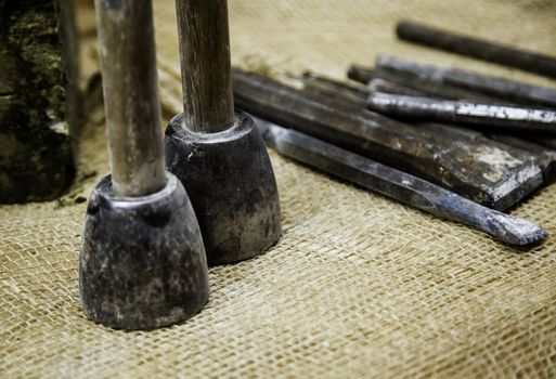 Old tools for carving stone of handmade way, detail of old manual craft