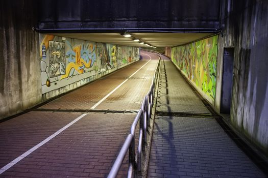 Tunnel with graffiti in bruges, detail of painting and decoration
