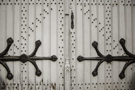 Old wooden door with metal, medieval door detail, decoration and security