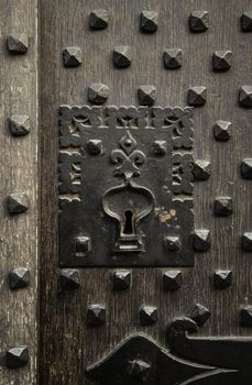 Ancient decorated metallic lock, detail of security and decoration