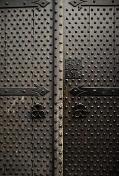 Old wooden door with metal, medieval door detail, decoration and security