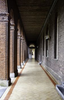 Old corridor with arches, detail of ancient architecture