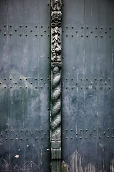 Old wooden door with metal, medieval door detail, decoration and security