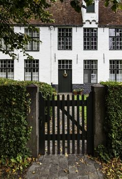 Begijnhof, typical and old district of Bruges, detail of typical Belgian house, tourism in Europe