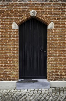 Old door in Bruges, door of old medieval house