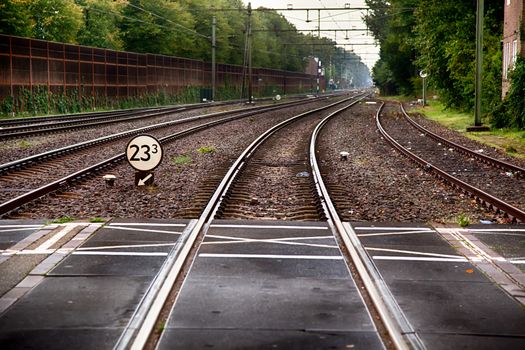 Train tracks in a station, transport detail by rails, trip