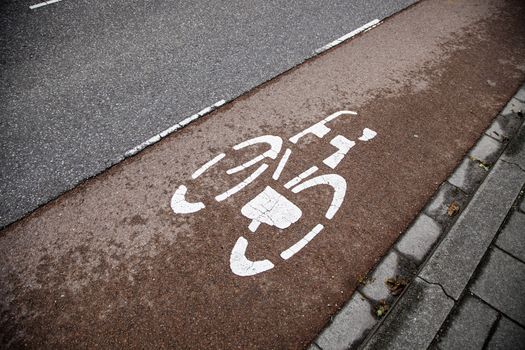 Bicycle sign with arrow, detail of information, transport