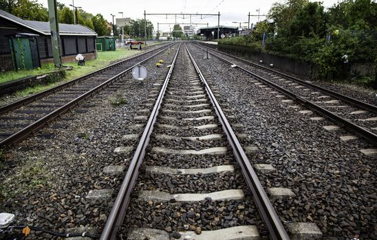 Train tracks in a station, transport detail by rails, trip