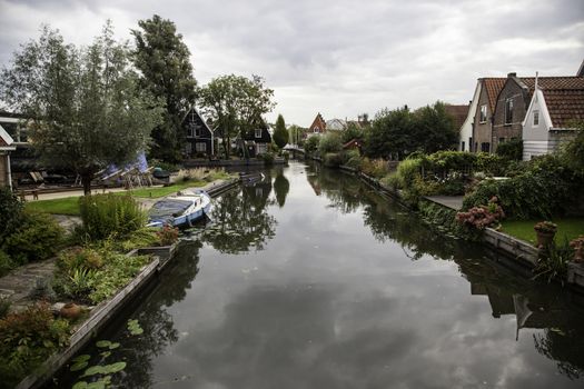 Medieval channels of Bruges, detail of tourism in a city of Belgium