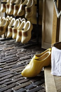 Dutch clogs craftsmen, manufacture of traditional footwear for the field