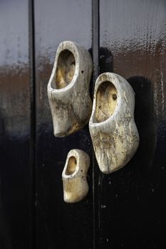 Dutch clogs craftsmen, manufacture of traditional footwear for the field