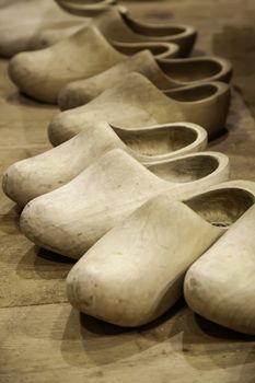 Dutch clogs craftsmen, manufacture of traditional footwear for the field