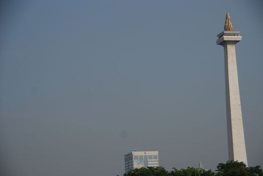 National Monument or MONAS (Monumen Nasional) seen from Gambir Train Station in Jakarta, Indonesia