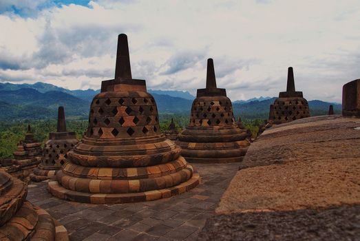 Around the circular platforms are 72 openwork stupas, each containing a statue of the Buddha.