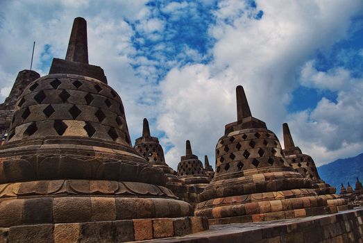 Around the circular platforms are 72 openwork stupas, each containing a statue of the Buddha.