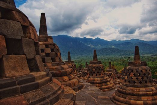 Around the circular platforms are 72 openwork stupas, each containing a statue of the Buddha.