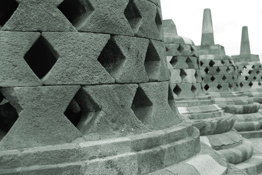 Around the circular platforms are 72 openwork stupas, each containing a statue of the Buddha.