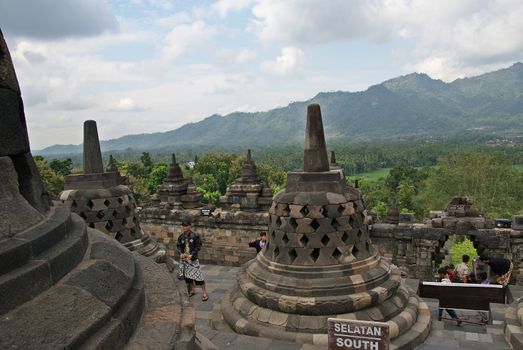 Around the circular platforms are 72 openwork stupas, each containing a statue of the Buddha.