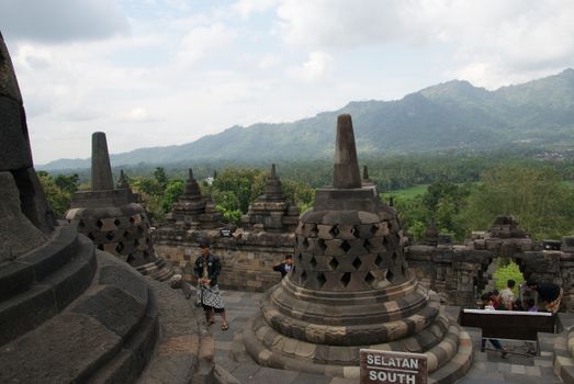 Around the circular platforms are 72 openwork stupas, each containing a statue of the Buddha.