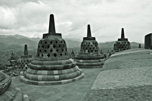 Around the circular platforms are 72 openwork stupas, each containing a statue of the Buddha.