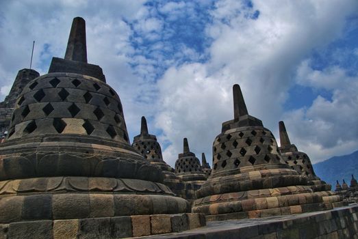 Around the circular platforms are 72 openwork stupas, each containing a statue of the Buddha.