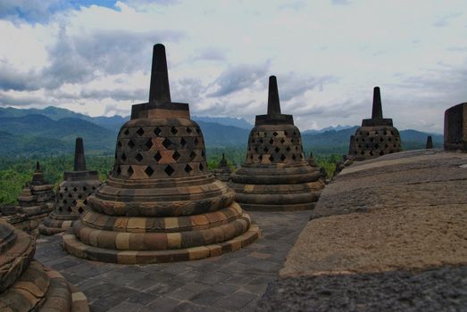 Around the circular platforms are 72 openwork stupas, each containing a statue of the Buddha.