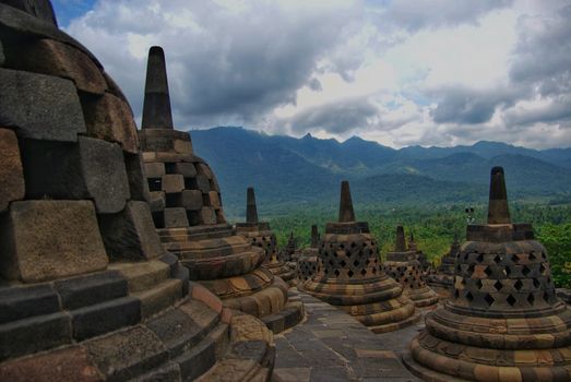 Around the circular platforms are 72 openwork stupas, each containing a statue of the Buddha.