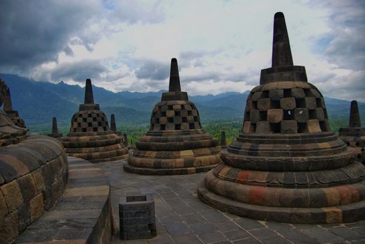 Around the circular platforms are 72 openwork stupas, each containing a statue of the Buddha.