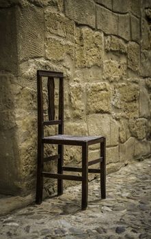Old wooden chair, detail of relaxation and rest